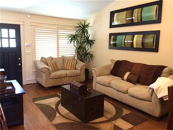 The living room is very open and cozy and check out the GORGEOUS wood floors!