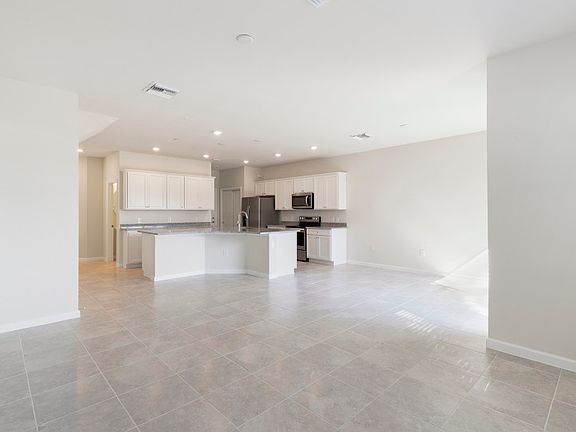 Open floor plan with plenty of natural light and tile floors