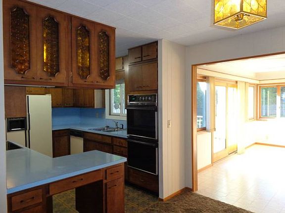 Kitchen includes stove, refrigerator, dishwasher and disposal.