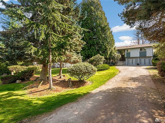 Home set back with long driveway