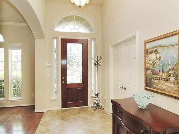 Beautiful Entry with 3/4 leaded glass door & travertine tile entry