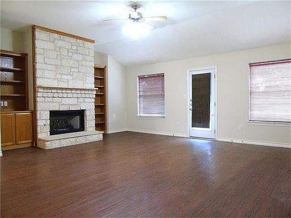 Living Room going out into the fenced yard
