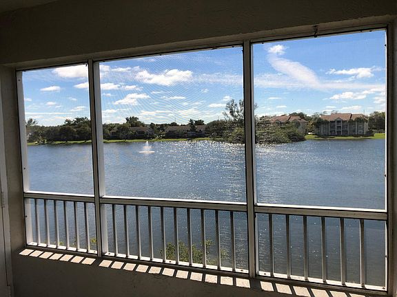 Enclosed porch with unobstructed views of the lake. Lake views from master bedroom and living room.