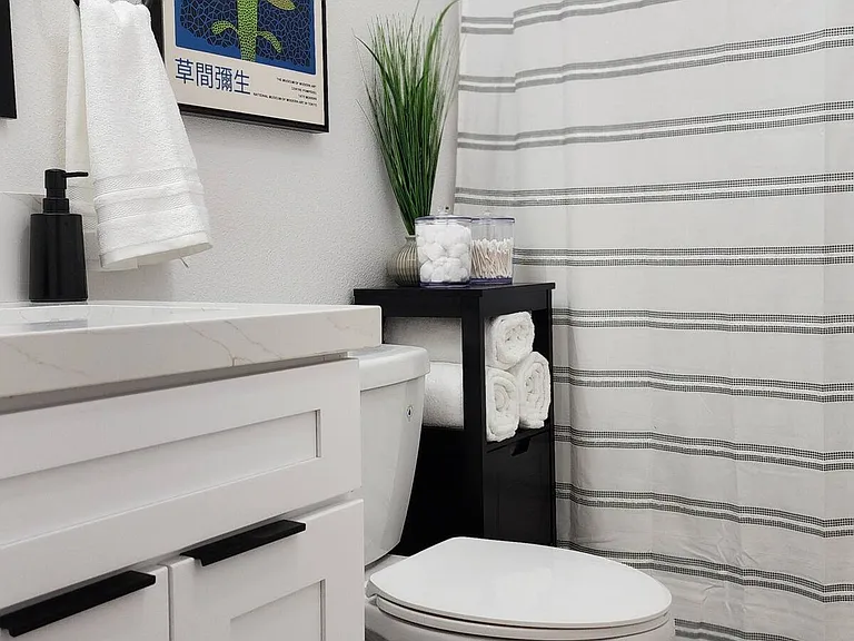 Bathroom is stocked with linens