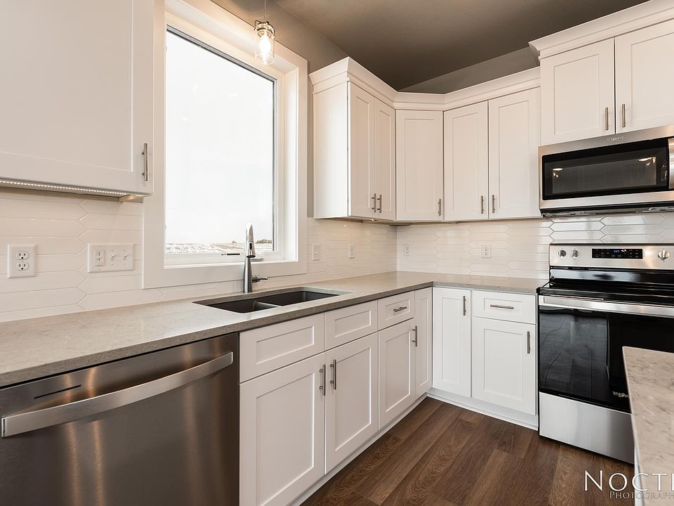Beautiful kitchen. (Photo of another unit with similar finishes and quality.)