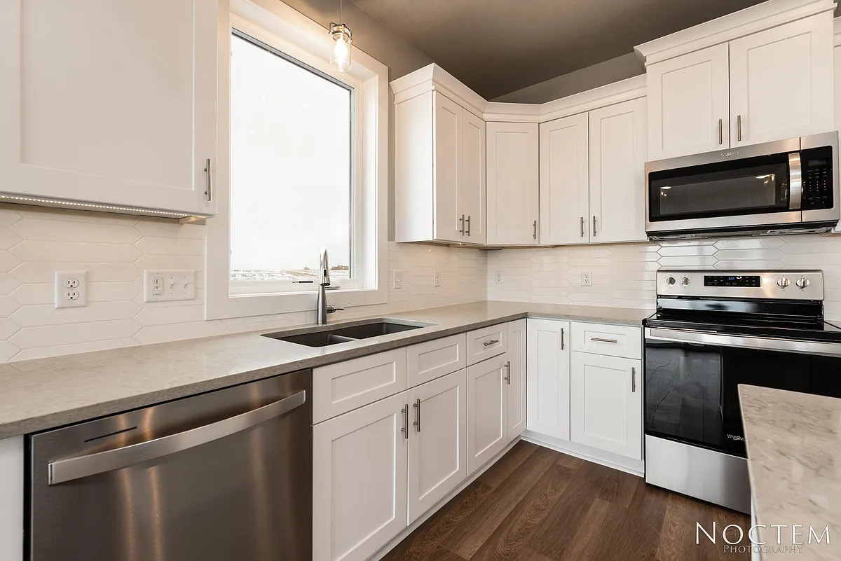 Beautiful kitchen. (Photo of another unit with similar finishes and quality.) - 5703 Iron Dr