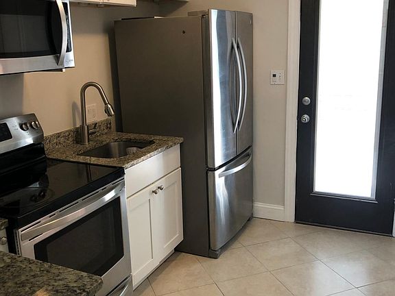 Kitchen with full view door to yard