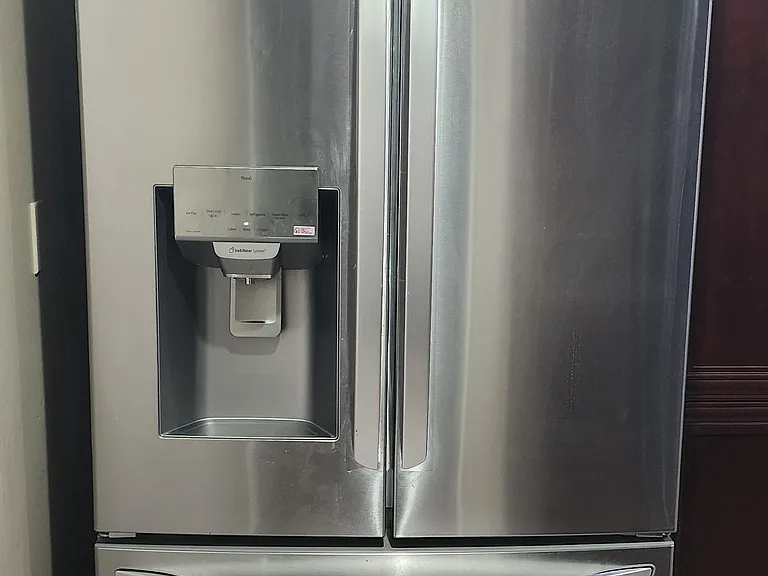 New Fridge. Ice and water in the door, and craft round ice below in the drawer freezer. This is 28 CuFt, Large fridge.