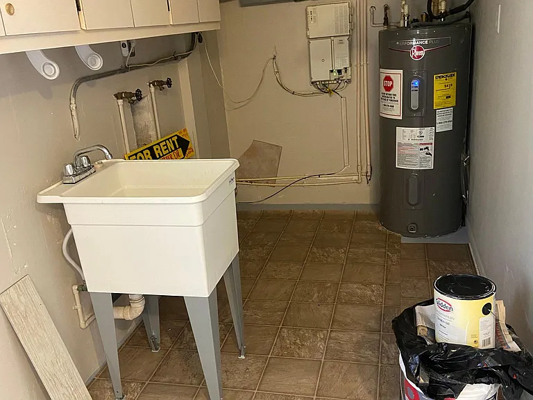 View of washer and dryer hookup area in garage.