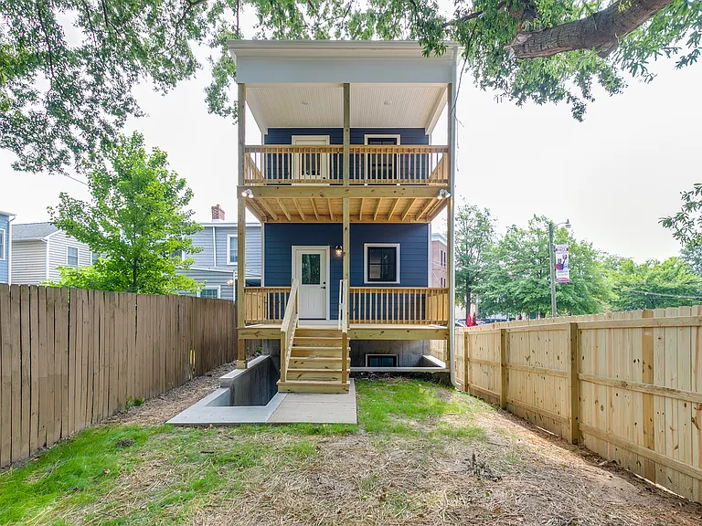 Privacy fenced backyard with off-street parking spaces off alley; shared with tenant in unit below