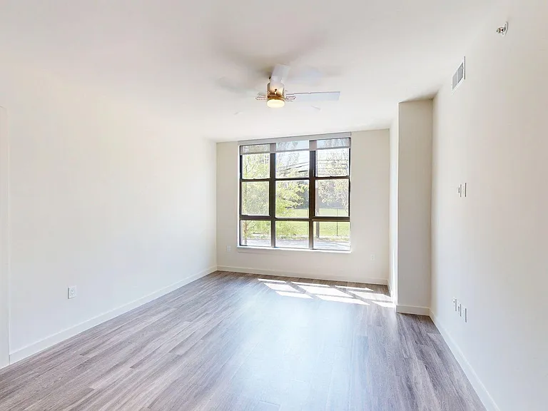 Apartment living room with wood-style flooring.
