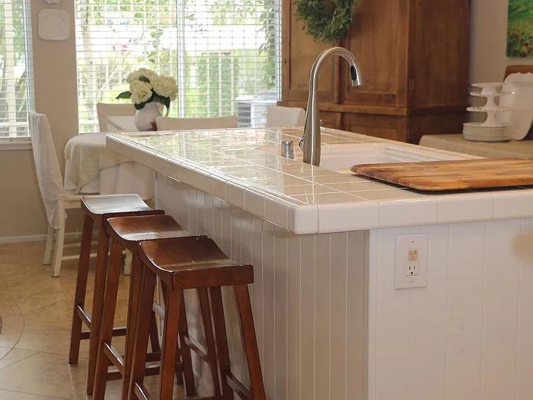 Kitchen island overlooks family room, with view of Tiburon Park.