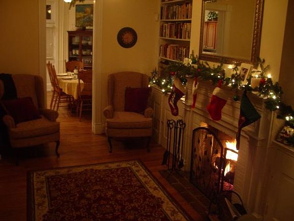 Living room with working fireplace and built in bookshelves