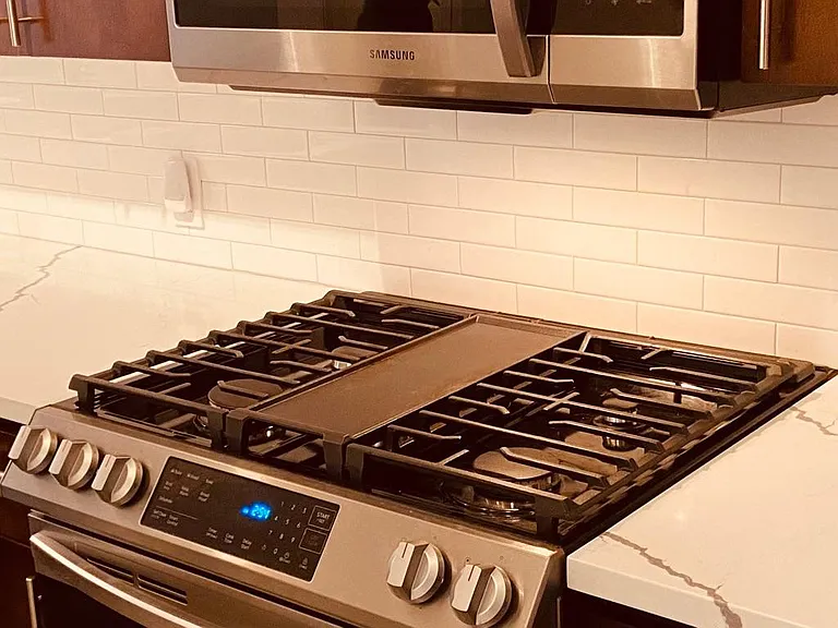Top of the line gas stove and oven.