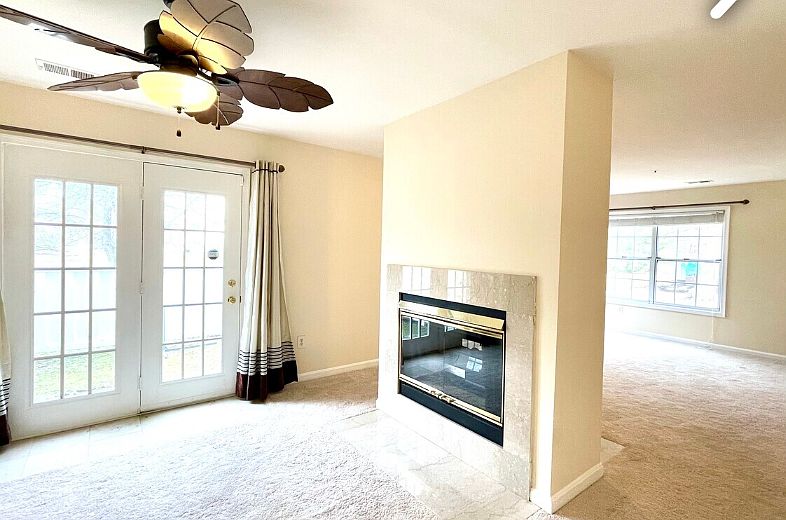 Family/living room with floating fireplace