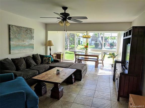 Looking from front door and kitchen area to the main living space. Open floor plan with lots of light and room to enjoy the outdoors as well as the indoors.