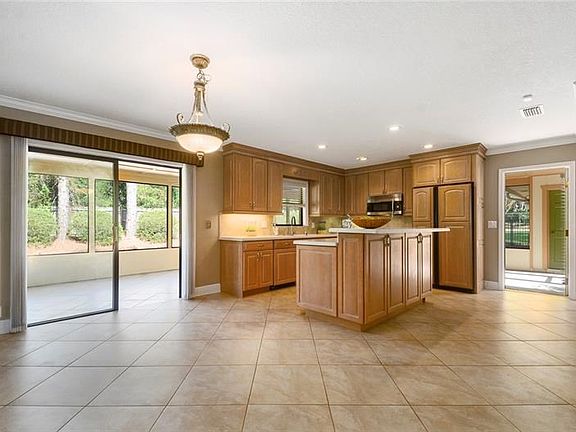 Island kitchen features eat-in space and breakfast bar