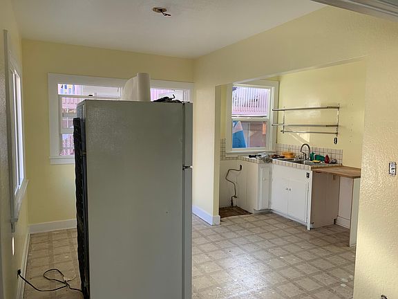 Kitchen before new stove, dishwasher and floors