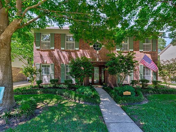 You will truly enjoy the abundance of shade the mature trees in the front yard bring to the home.