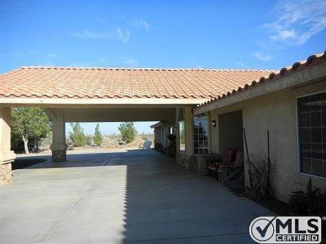 Portico from the West.  Note the love seat on the right in the shade.