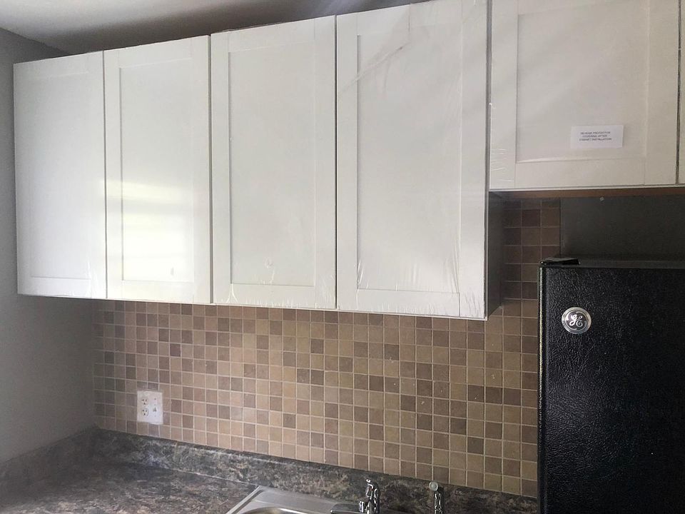 All new cabinets, countertops, sink, backsplash.