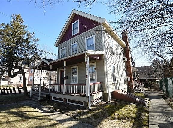 This home has it all: wrap-around porch, full walk-up attic, Bilco doors to basement, side entrance easily accessible from back yard, barn and garage/studio