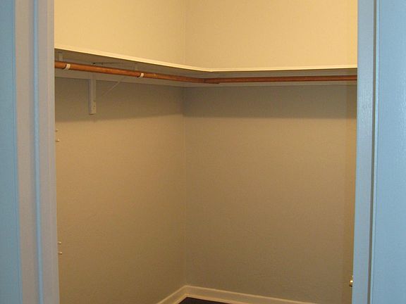 Large walk in closet with shelves