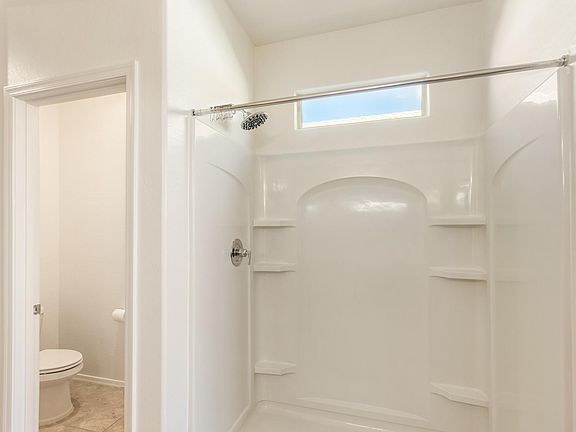 Large Master bath with stand up shower and private restroom.