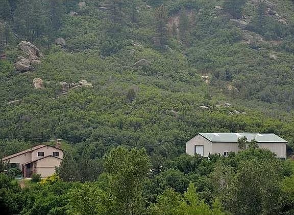 Home pictured on left; 2,160 sq ft outbuilding on right