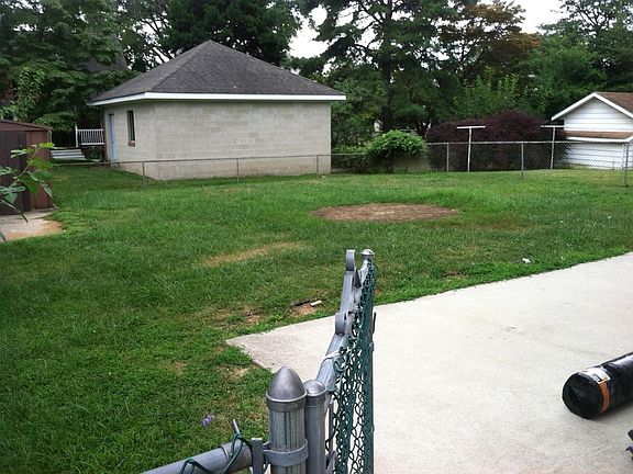 Large, fenced-in backyard. Concrete patio, great for parties!