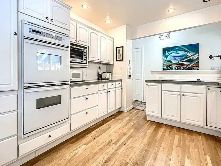 Upper level Kitchen: dual ovens, new refrigerator, dishwasher, stove, microwave, toaster oven, toaster, espresso machine, coffee/tea nook