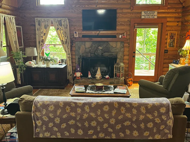 Spacious den with fireplace.