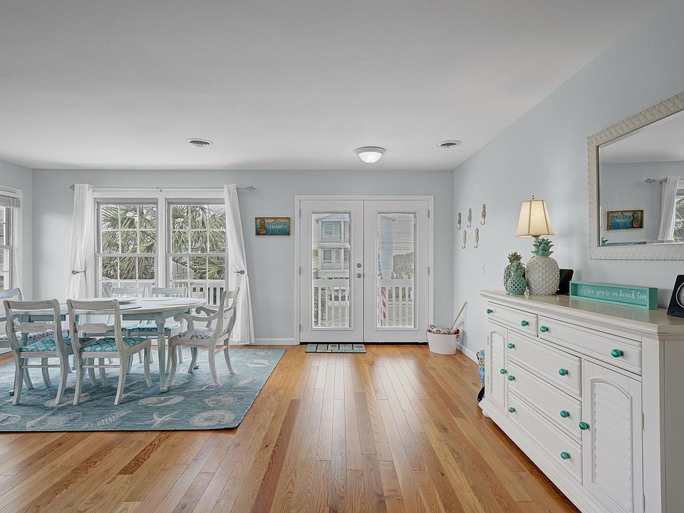Open concept with living room opening into dining area