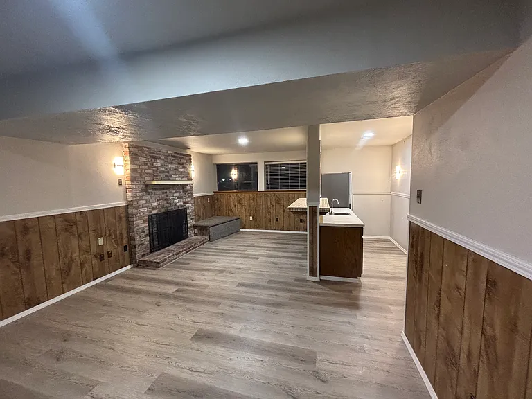 Massive downstairs family room with retro fireplace and wet bar, great for entertaining!