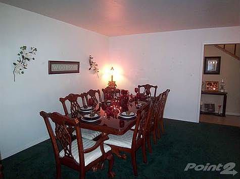 The formal dining room is spacious enough for family gatherings.