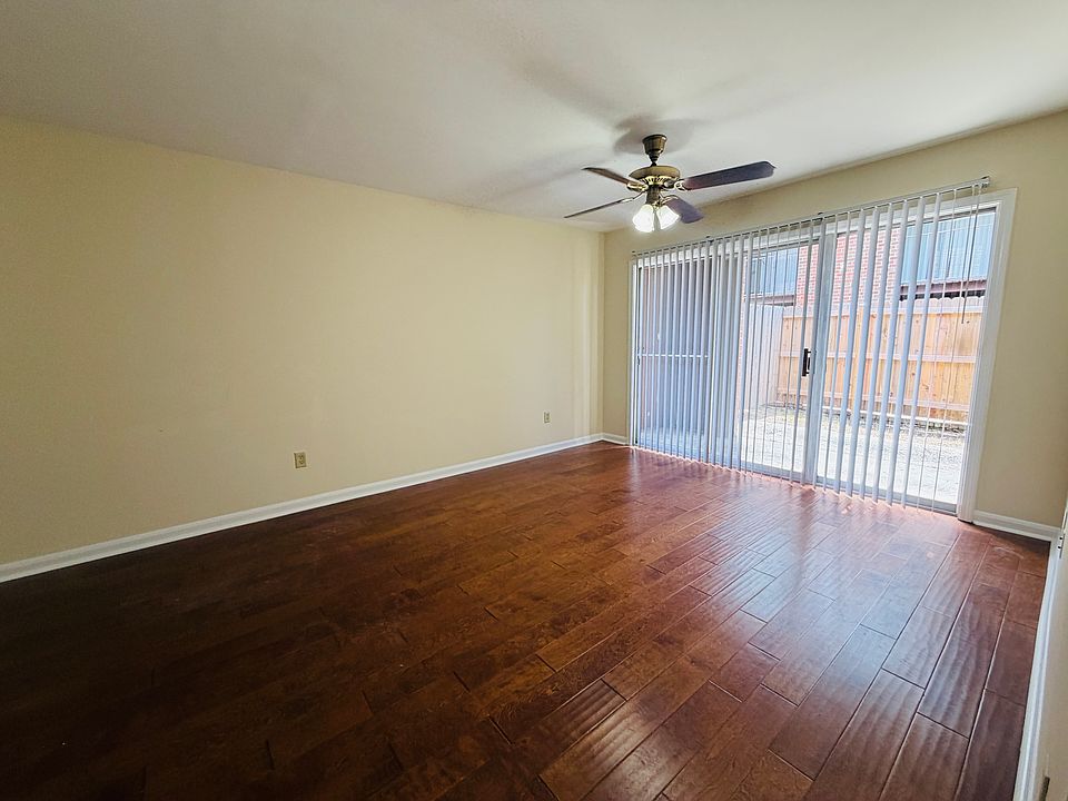 Living room with private fenced in patio
Wood floors 
New paint