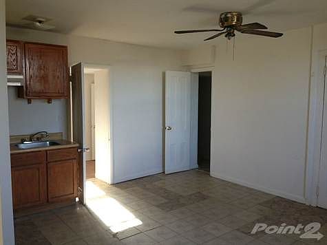 Living Room looking to Den and Bath Entry