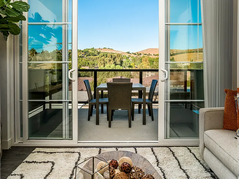 The Harrington furnished living room with balcony