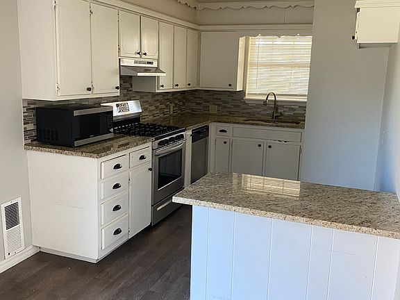 Kitchen, gas stove, microwave, dishwasher, disposal