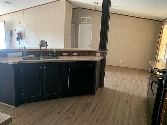 Standing at laundry room door looking into kitchen