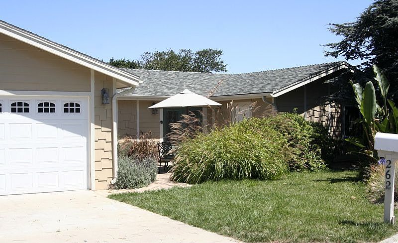 Hardi-plank, landscaped with lawn, architecural shingles