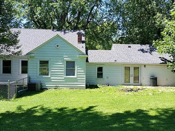 Back exterior looks sharp and has such potential for a wonderful outdoor space!
