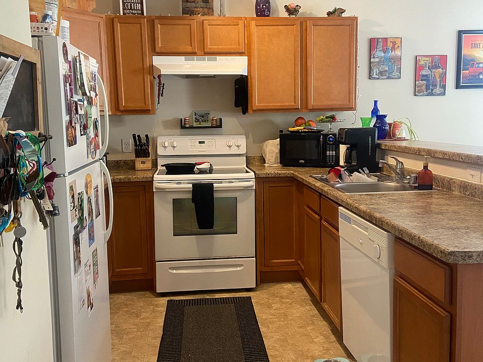 Kitchen with fridge, electric range, and dishwasher