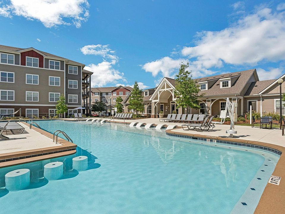 Enjoy resort-style living at The Flatts Starkville with poolside seating and luxurious outdoor amenities.