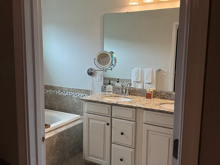 Primary Bathroom filled with amenities