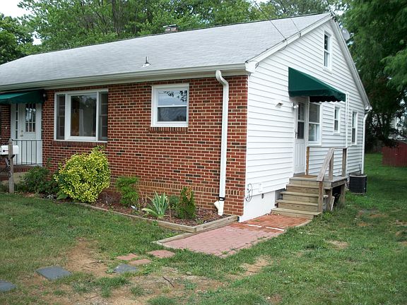 Duplex- Half the house is your home. Side entrance into kitchen and center door.