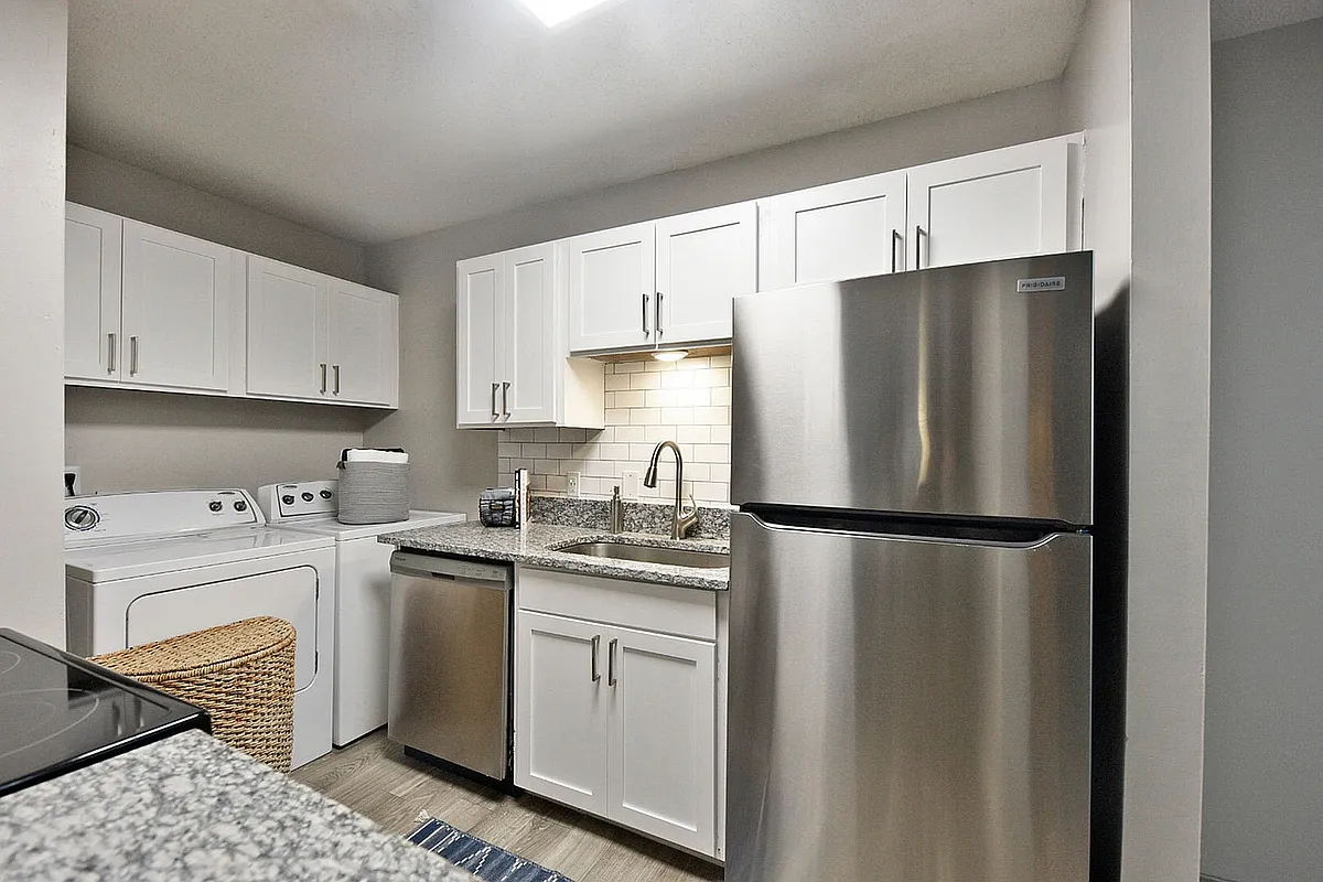Kitchen with granite counters and stainless appliances - Arcadia Creekside
