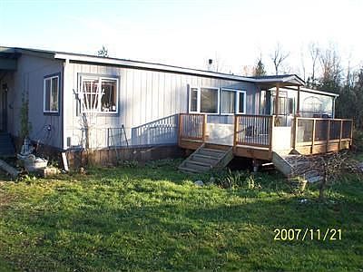 FRONT VIEW LOOKING SOUTH AND IN THE AFTERNOON, MANY SMALL OUTBUILDINGS, GAZEBO'S, BIRD HOUSES, HOT T
