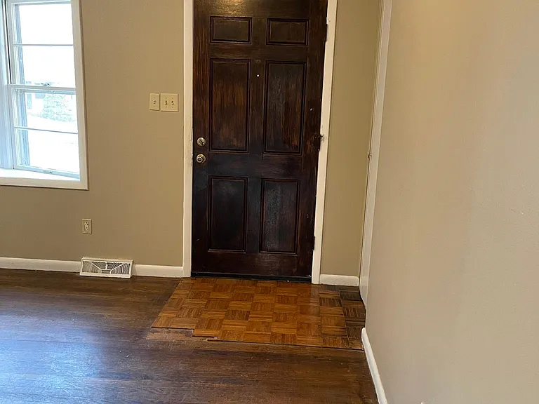 Front door with hall closet, to hang your coats.