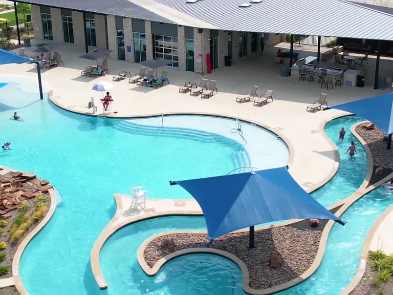 This is one of the two community pools, includes a lazy river and splash pad, outdoor kitchen and more.